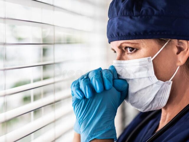 stressed-female-doctor-nurse-break-window-wearing-medical-face-mask-179923102