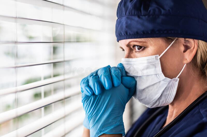 stressed-female-doctor-nurse-break-window-wearing-medical-face-mask-179923102